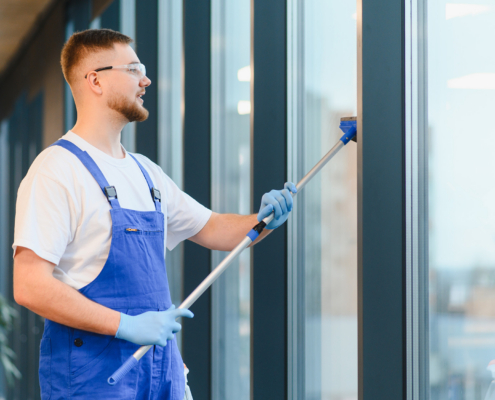 Professional Window Cleaner Washing Office Building Glass